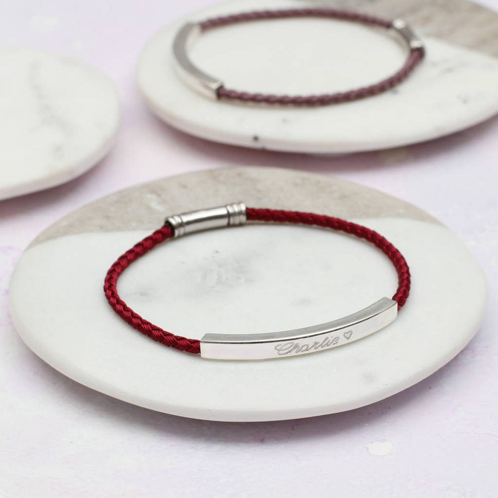 Red silk twisted bracelet with a Sterling Silver bar engraved with the name ‘Charlie’.