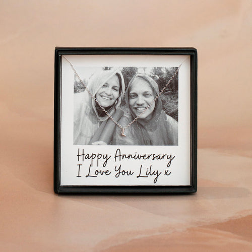 Framed photo of two people with a personalized message on a beige background
