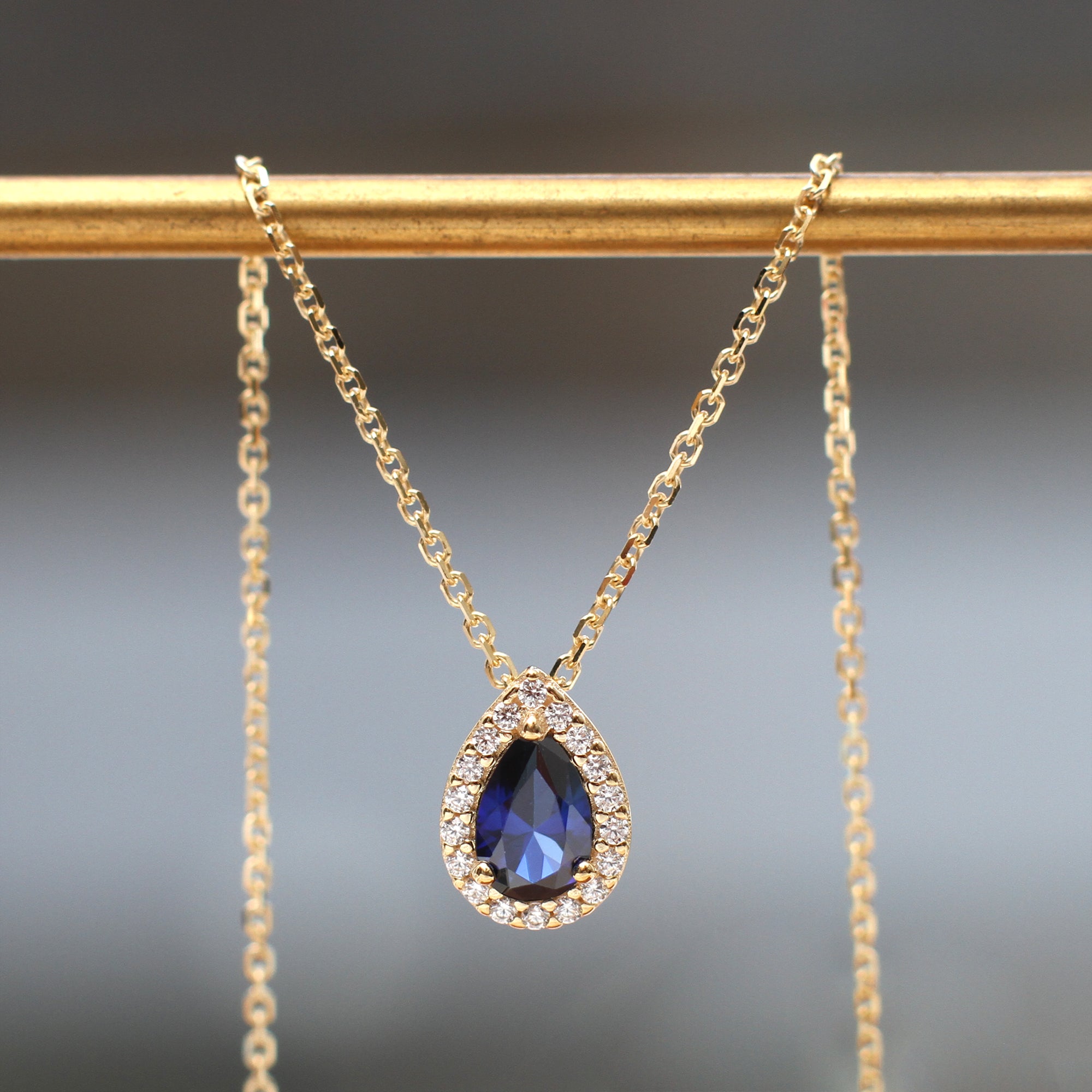 9ct Yellow Gold Blue Pear Shape Cz Halo Necklace