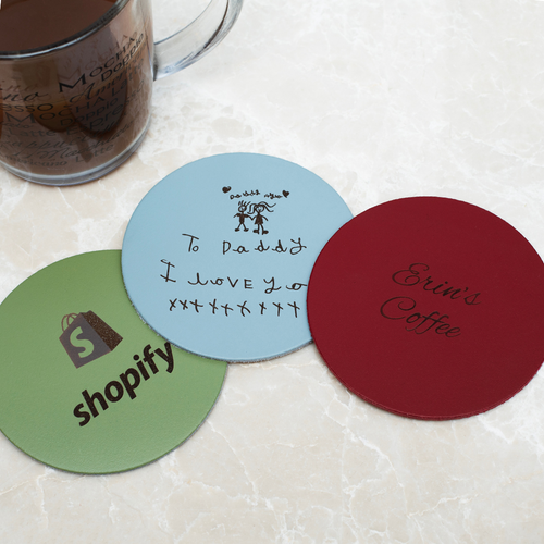 Three coasters with a mug of coffee positioned to the upper left